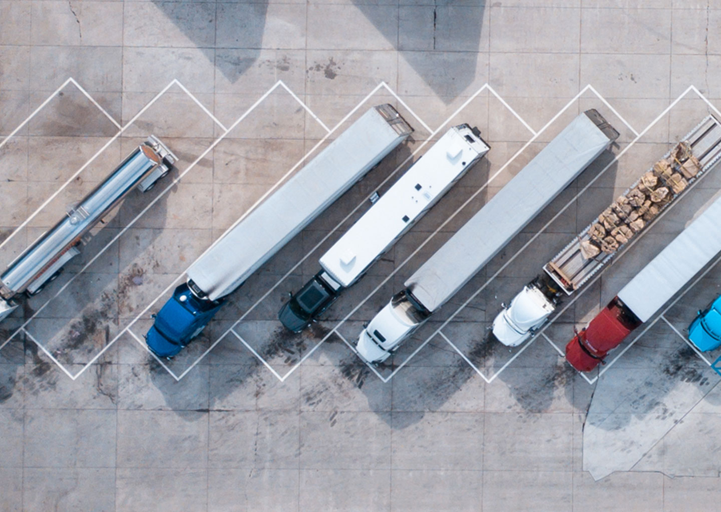trucks parked at a rest stop, representing the supply chain process and supply chain management