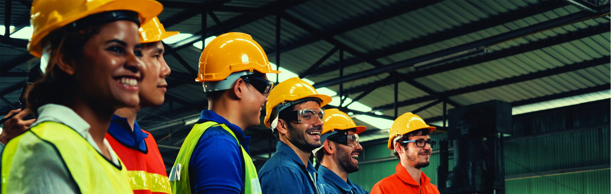 Employees in a safety meeting discussing process variation and its impact on workplace efficiency, focusing on reducing common cause and special cause variation.